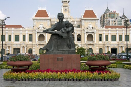 Statue of Ho Chi Minh and Peoples Committee Building in Ho Chi Minh city